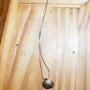 Gold toned Sand Dollar necklace